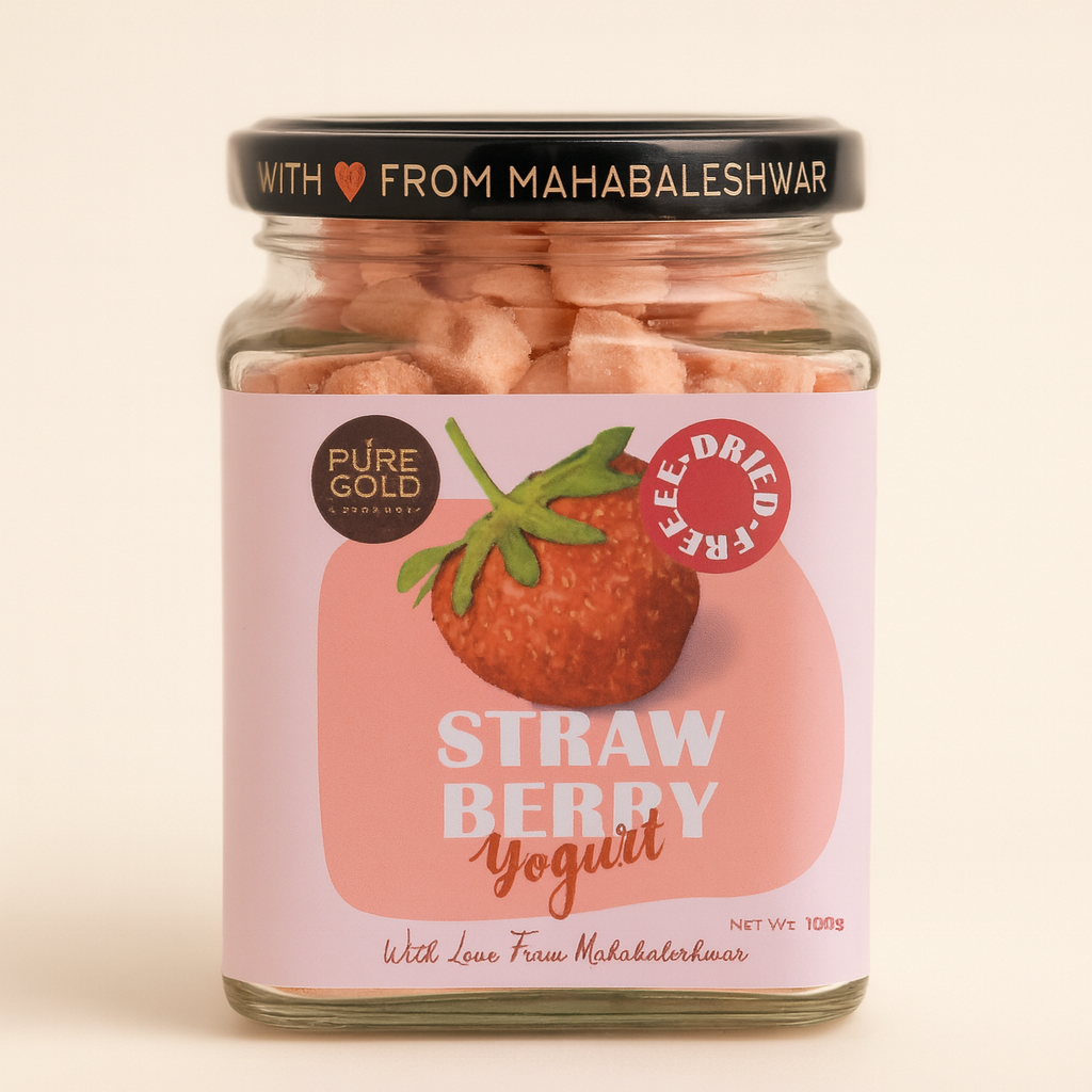 A clear glass jar containing freeze-dried strawberry yogurt bites, labeled as 'Strawberry Yogurt' with a stylish design and details from Mahabaleshwar.