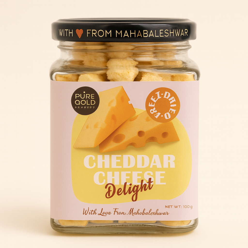 A jar of Cheddar Cheese Delight snacks with a colorful label reading 'CHEESE Delight' and 'PURE GOLD' on a soft background.